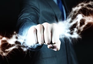 Close up of businessman hand holding lightning in fist.jpeg