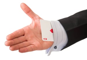 ace card held by business man.jpeg